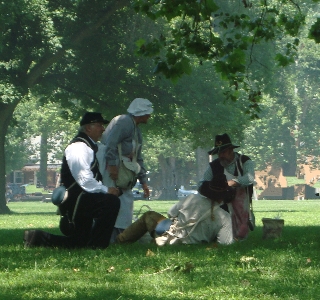 Chaplain Springer and Nurse Grayson attend to the wounded